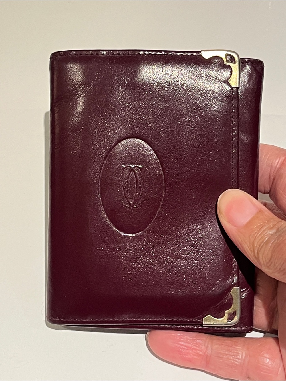 Cartier Leather Wallet in Deep Burgundy with Corner Metal Accents